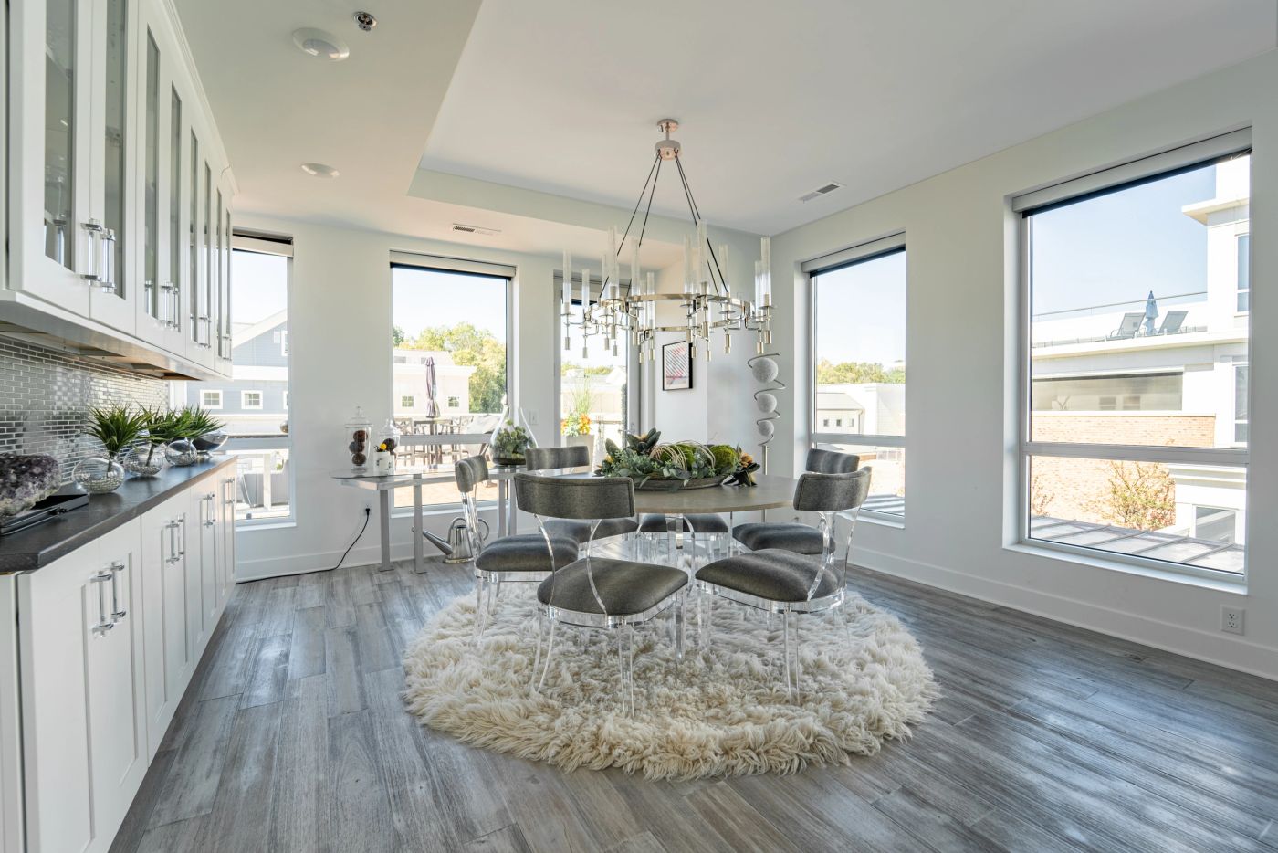 Open plan living and kitchen by Daniel Home with a sculptural inlaid feature wall