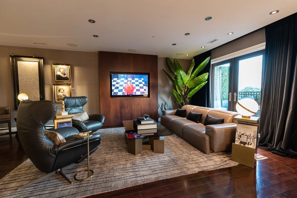 Living space by Daniel Home in a warm neutral palette with timber detailing